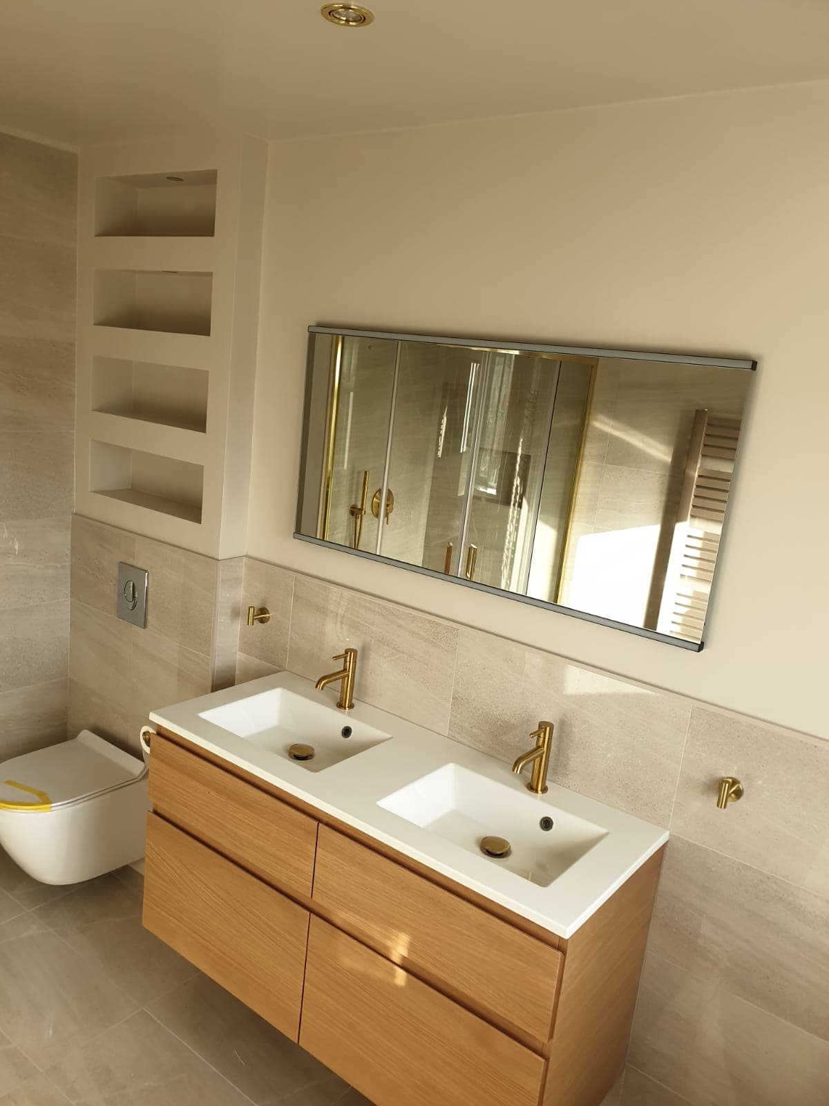 Luxury bathroom remodel with contemporary fixtures and tiling