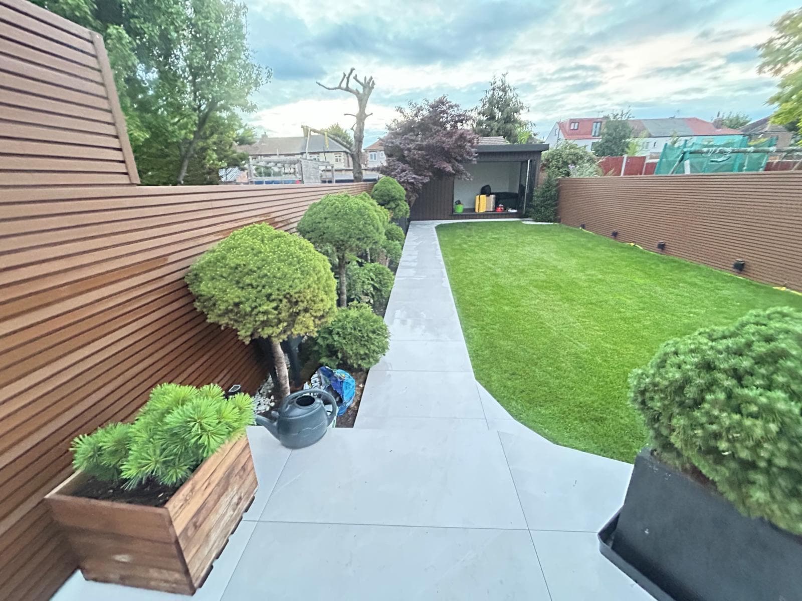 Outdoor renovation with paving and fencing